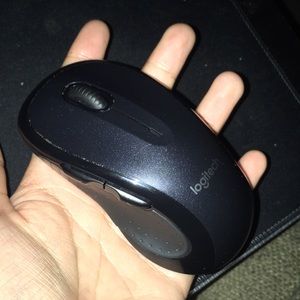 all black logitech mouse with two side buttons